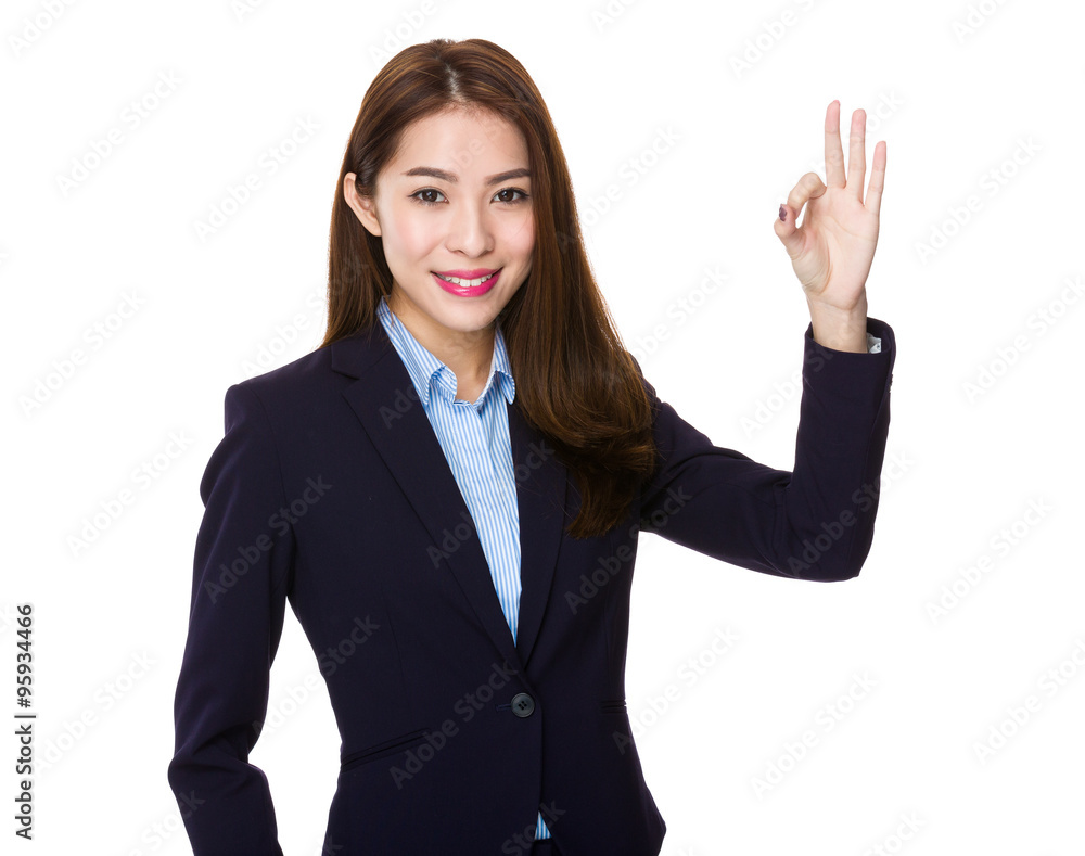Asian Businesswoman showing ok sign gesture Asian Businesswoman showing ok sign gesture