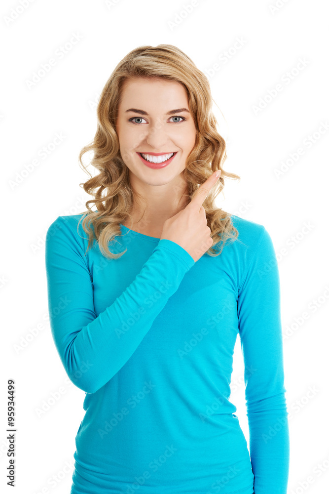 Woman pointing on copy space. Woman pointing on copy space.