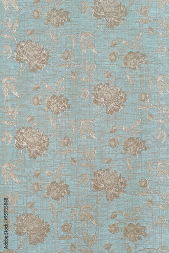 closeup blue fabric with silver roses