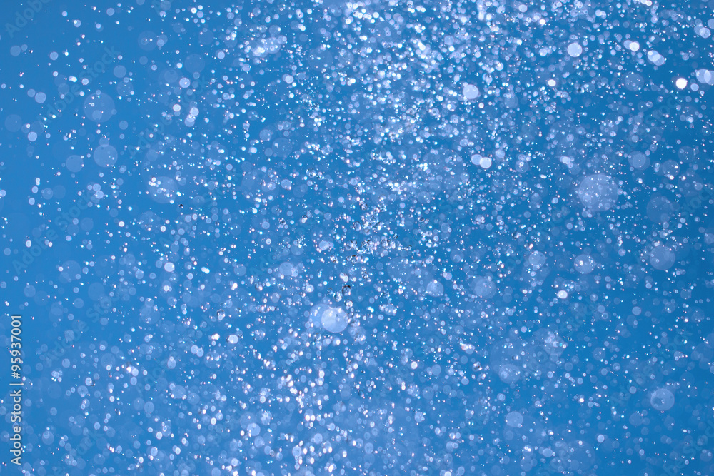 Fototapeta premium spray water on a blue background
