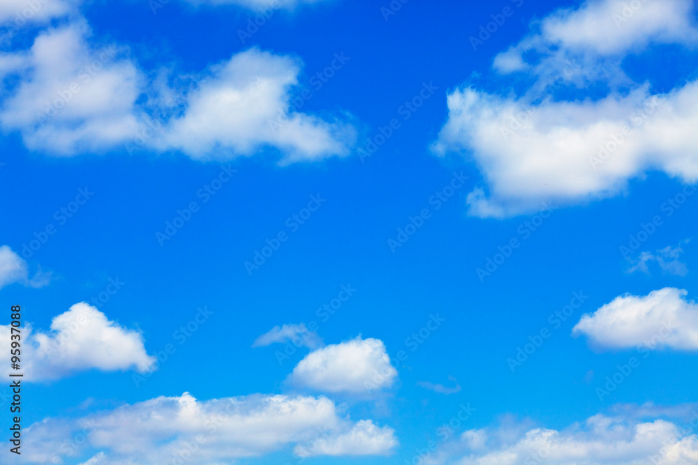 blue sky with white fluffy clouds background