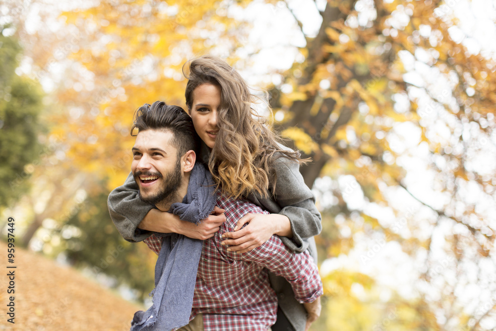 Young couple in the autumn forest Young couple in the autumn forest
