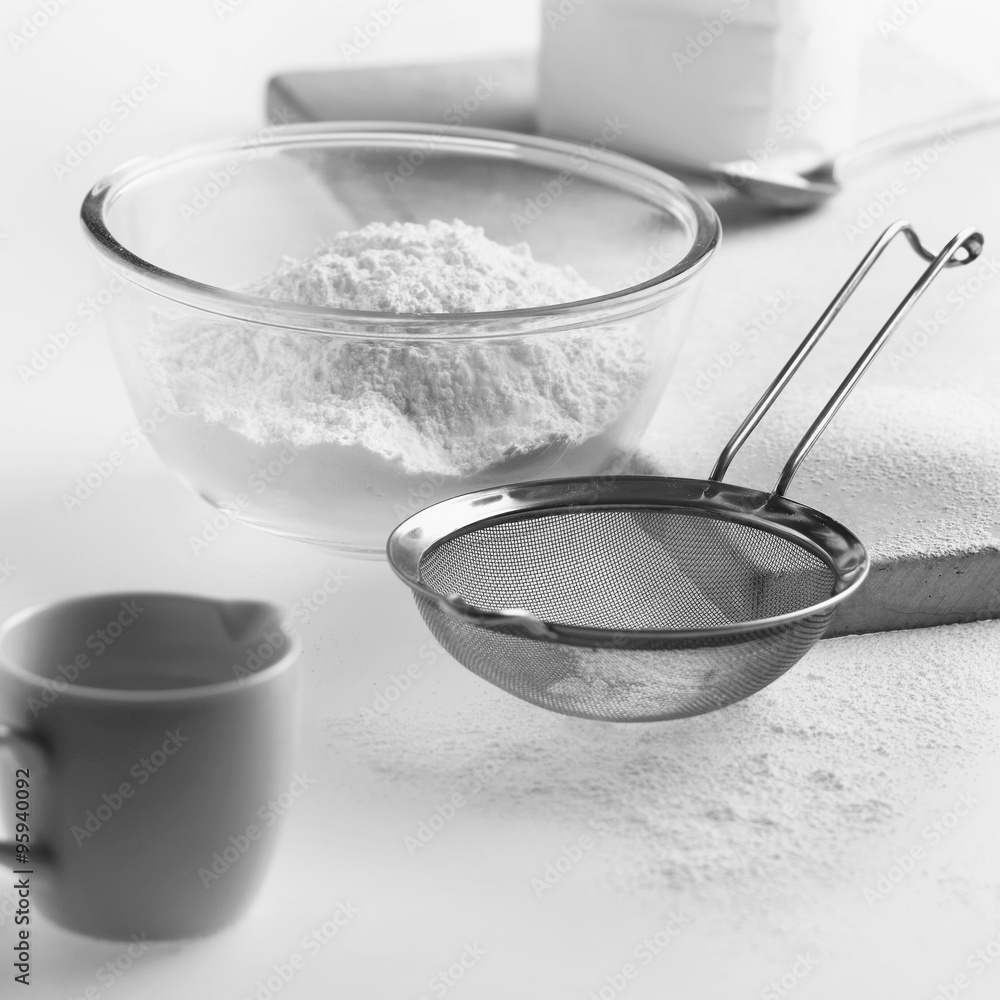 Cake icing ingredients and utensils on a kitchen worktop. Cake icing ingredients and utensils on a kitchen worktop.