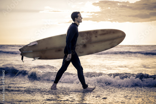 Photography Surfer wals on the beach