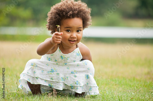 African girl with a flower