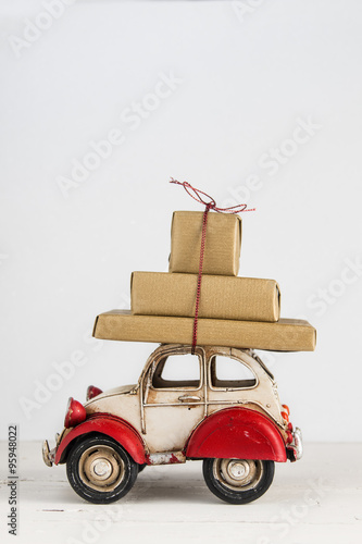 Gift boxes on toy vintage car