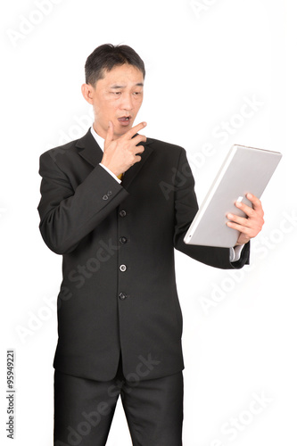 Asian business man using digital tablet computer.