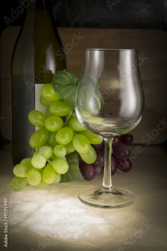 Still life: White wine in glass on a marble table elegant.