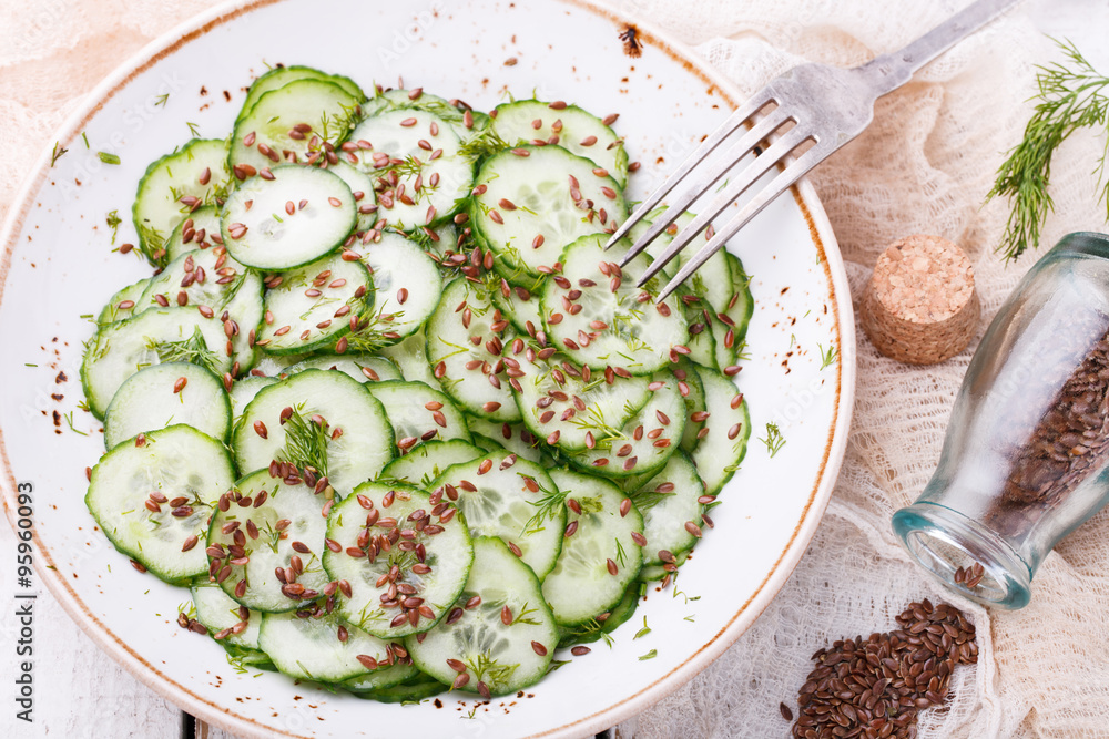 Cucumber salad with flax seeds.selective focus Cucumber salad with flax seeds.selective focus