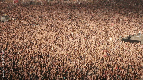 huge crowd,fans,full arena ,concert,cheering applauding hands in air aerial