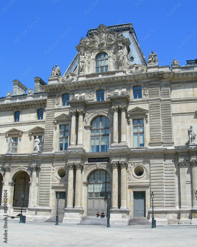 Architectural details of entry and interior court of the Louvre Museum in Paris, France