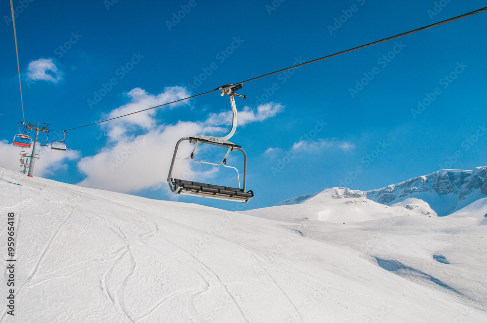 Ski lifts durings bright winter day Ski lifts durings bright winter day