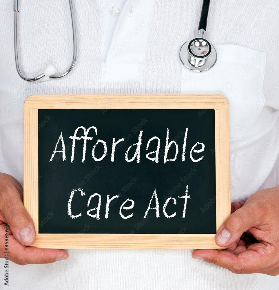 Affordable Care Act - Doctor holding chalkboard with text Affordable Care Act - Doctor holding chalkboard with text