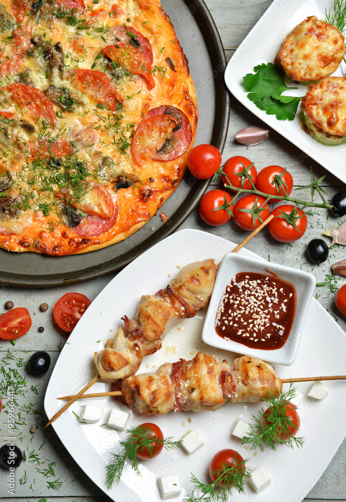 pizza kebab bbq tomatoes olives garlic on wooden rustic table pizza kebab bbq tomatoes olives garlic on wooden rustic table