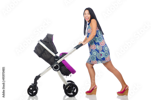 Happy mom with her baby in pram 