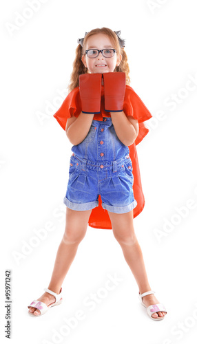 Fancy superhero girl with boxing gloves poses on white background