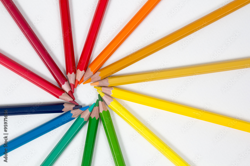 color pencils arranged in a circle on white background, top view color pencils arranged in a circle on white background, top view