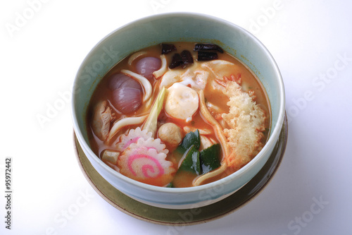 Tom Yum seafood udon isolated on white background. Thai style sp