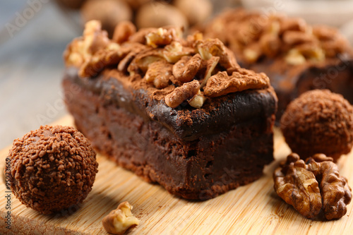 Wallpaper Mural A piece of chocolate cake with walnut on the table, close-up Torontodigital.ca