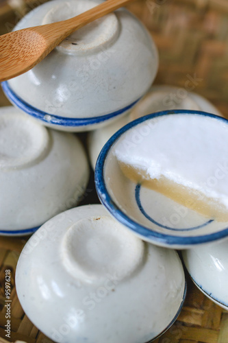 Thai dessert made of coconut milk on wood basket, Steamed Pandan