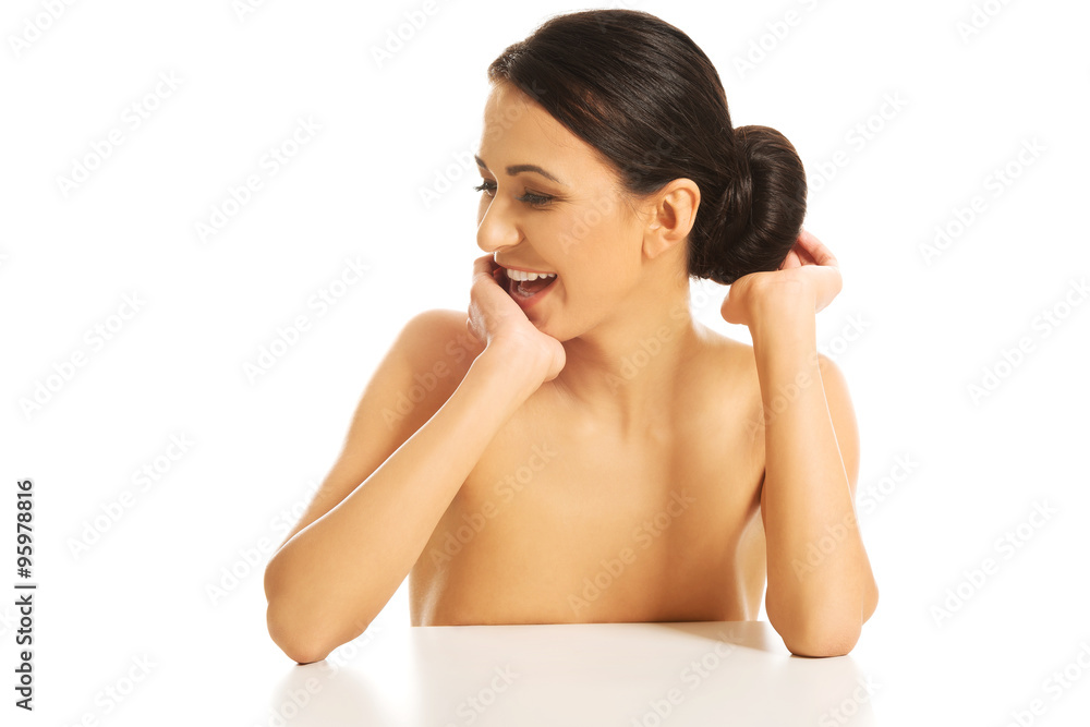Happy woman sitting, touching her bob Happy woman sitting, touching her bob
