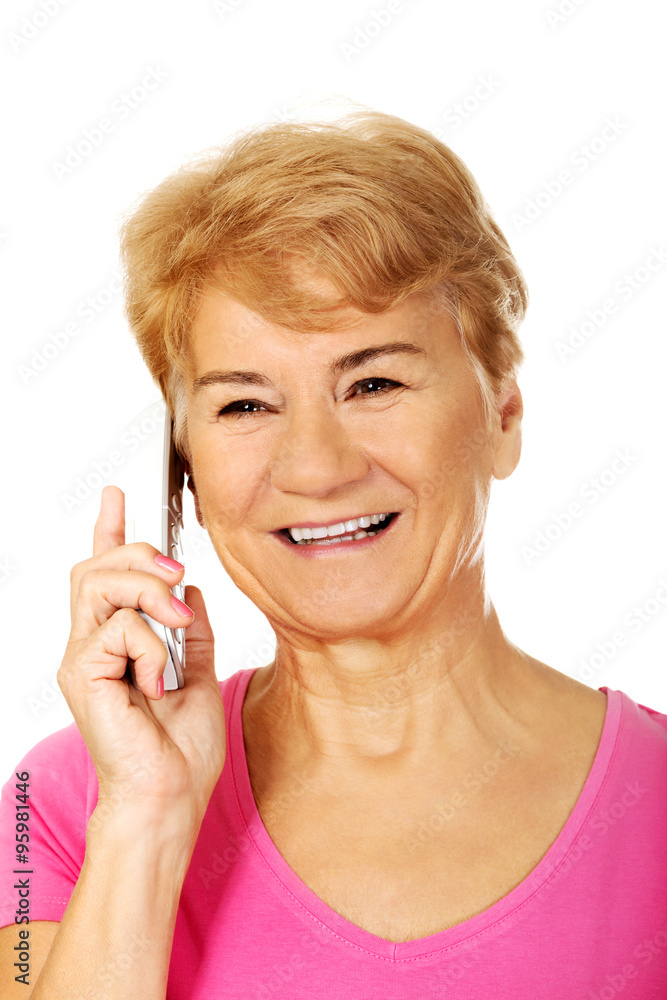 Smiling senior woman talking through phone Smiling senior woman talking through phone