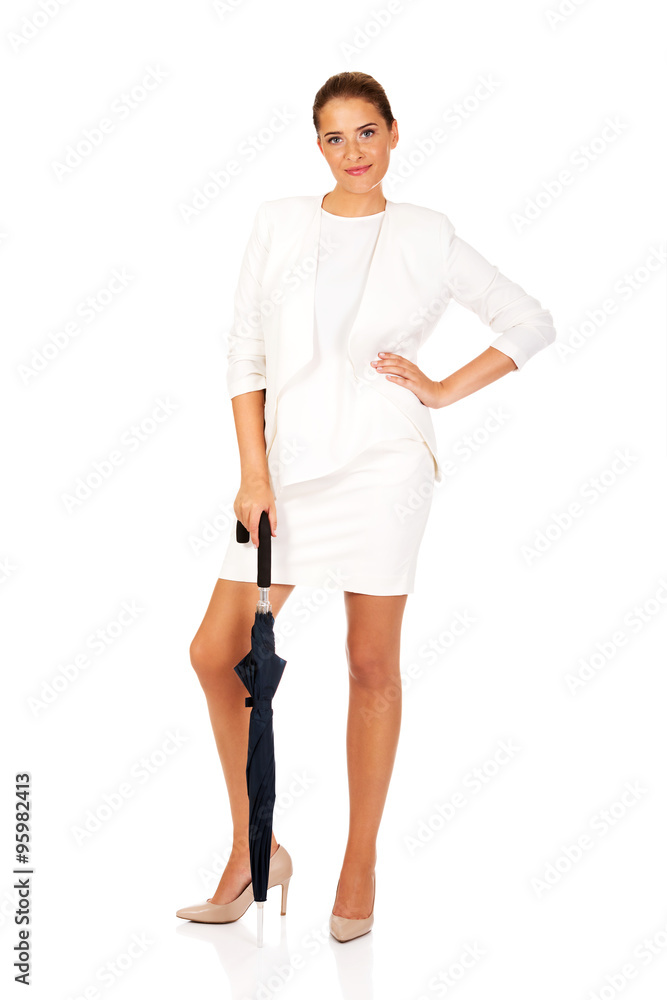 Fototapeta premium Blonde businesswoman holding an umbrella