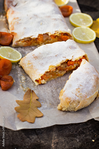 Strudel with custard and orange. Christmas Stollen. Christmas table decoration.