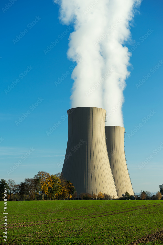 Nuclear power plant on the sky background in sunlight
