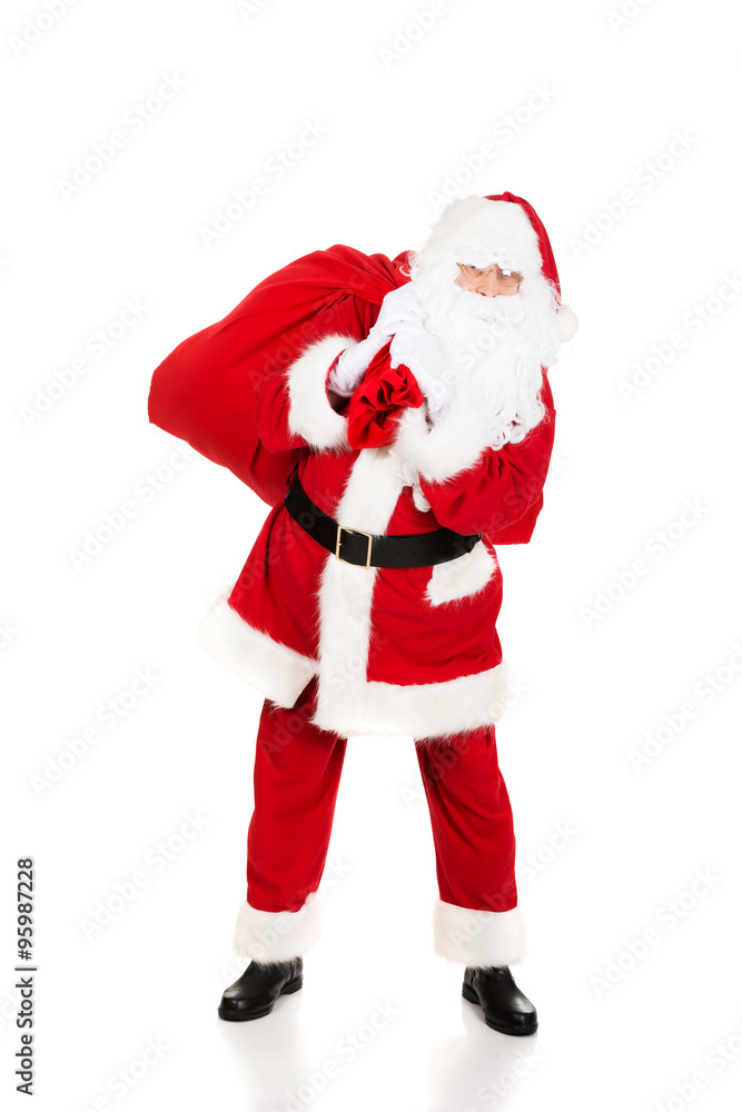 Santa Claus carrying bag with presents Santa Claus carrying bag with presents