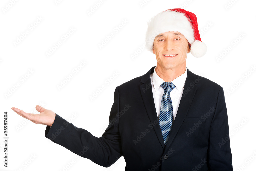 Portrait of santa businessman with welcome gesture Portrait of santa businessman with welcome gesture