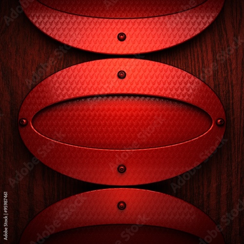 red pollished metal on wooden bachkround photo