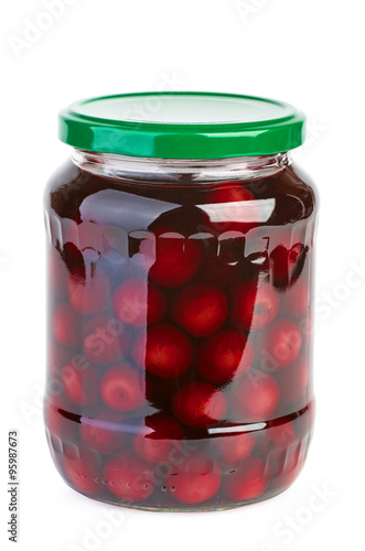 Glass jar with preserved cherries