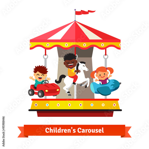 Kids having fun on a carnival carousel