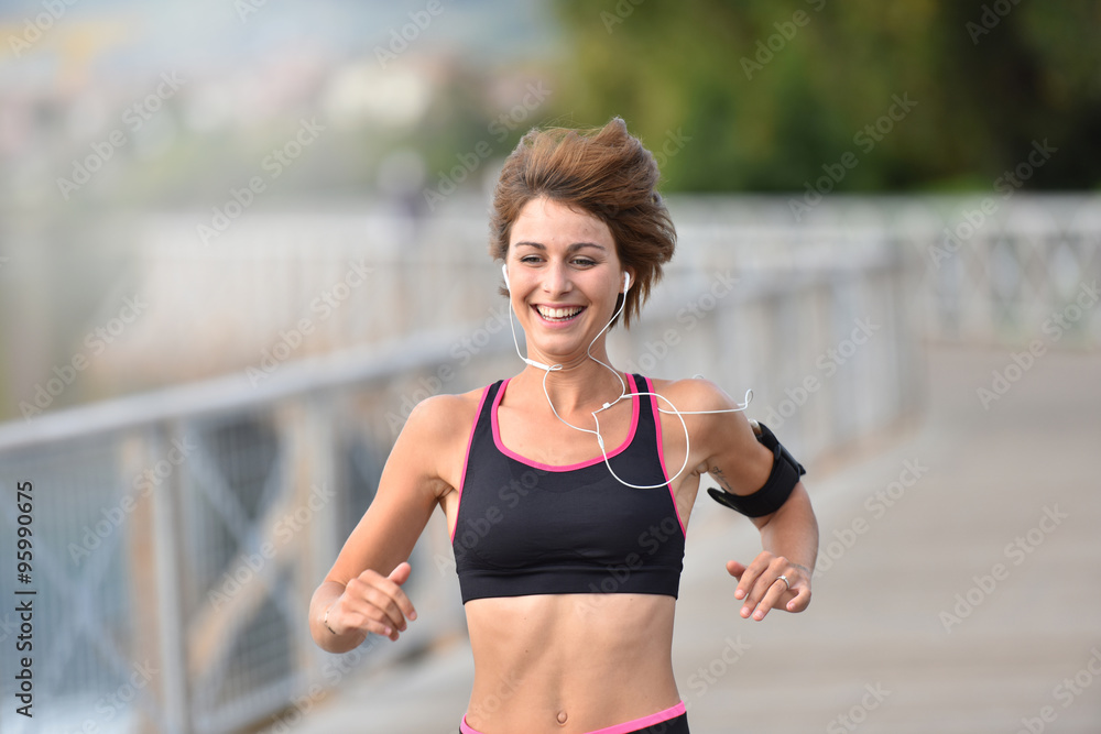 Cheerful athletic girl running outside Cheerful athletic girl running outside