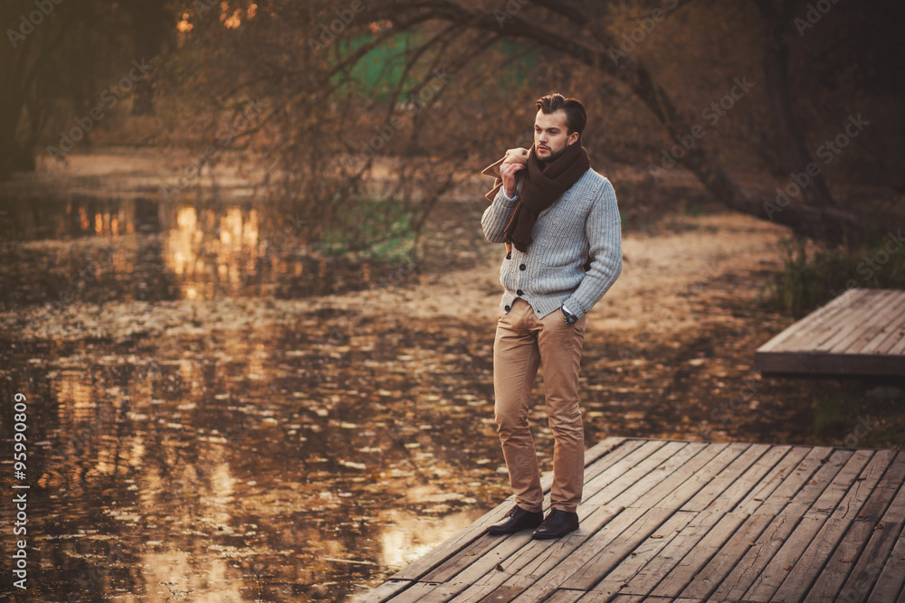 Fototapeta premium handsome man in autumn park