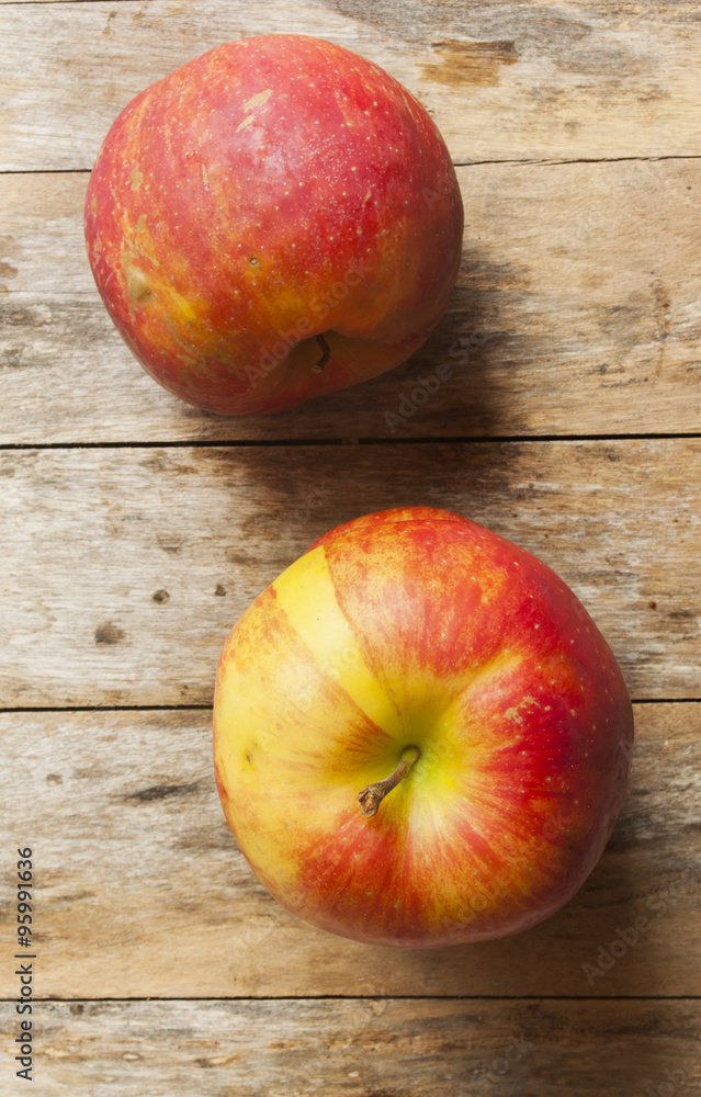 Ripe red apples on wooden background close up Ripe red apples on wooden background close up