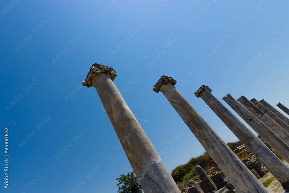 Ancient ruins of Perge on a background of blue sky. Turkey.