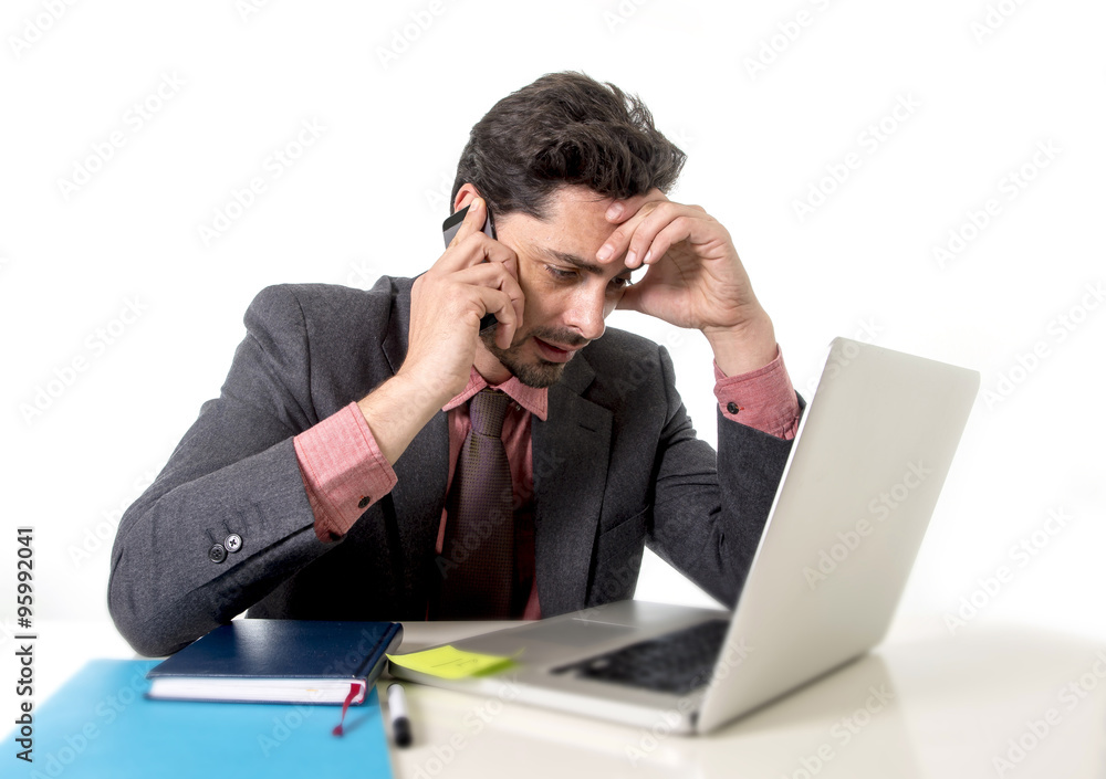 busy businessman working in stress on computer laptop talking on mobile phone busy businessman working in stress on computer laptop talking on mobile phone