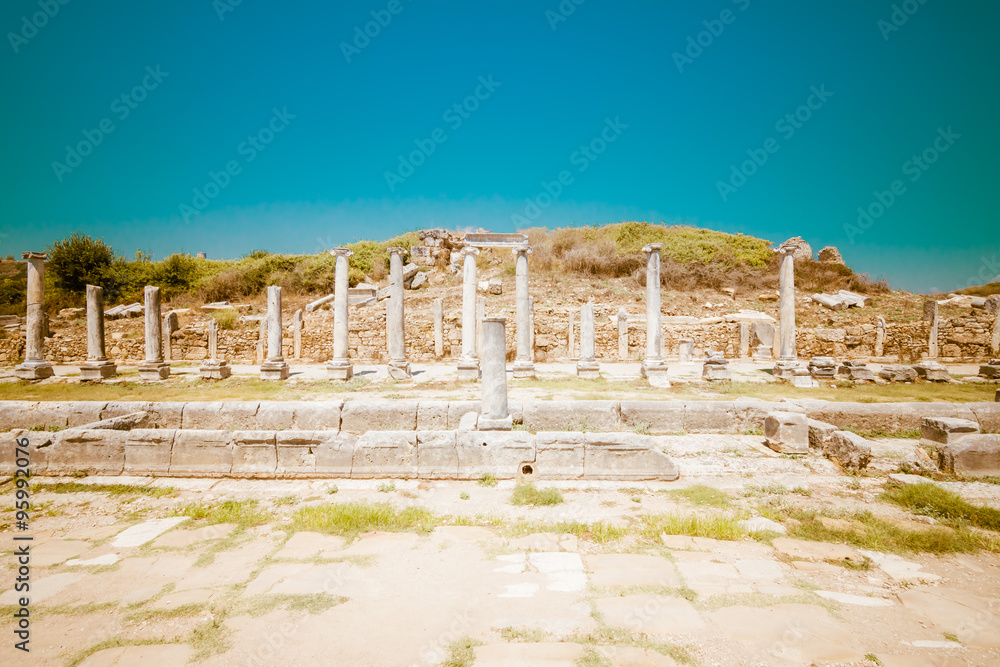 Obraz premium Ancient ruins of Perge. The colonnaded street. Stylized color film. Toning. Turkey