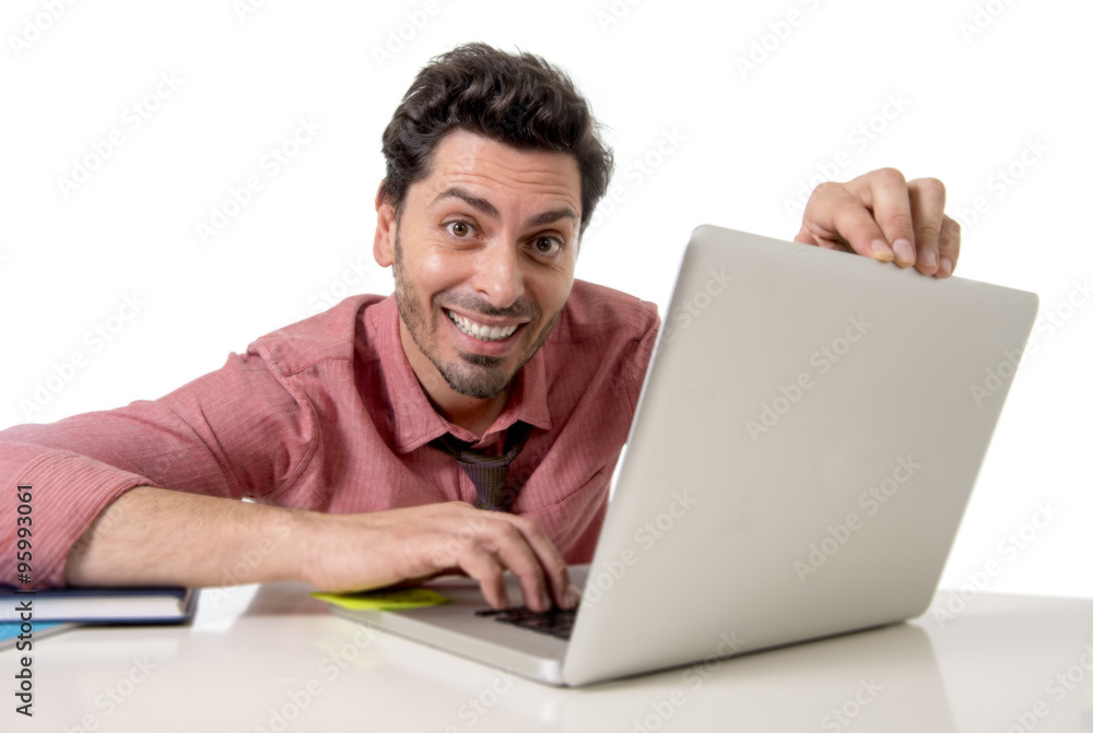 happy attractive businessman in shirt and tie at office desk working with computer smiling happy attractive businessman in shirt and tie at office desk working with computer smiling