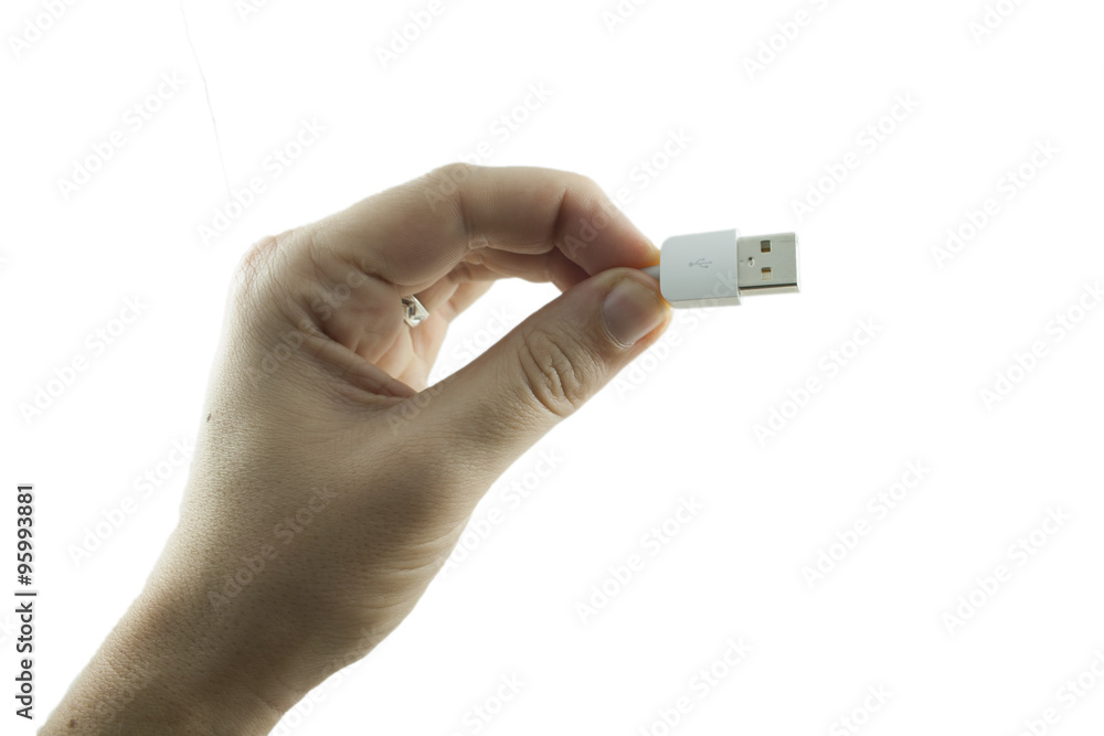 Mano regge un cavo usb bianco per carica smarphone Mano regge un cavo usb bianco per carica smarphone