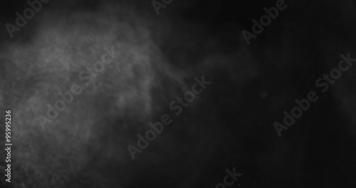 Dense particle cloud being blown away shot in studio
