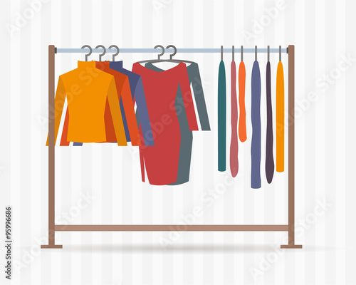 Clothes racks with dresses on hangers. 