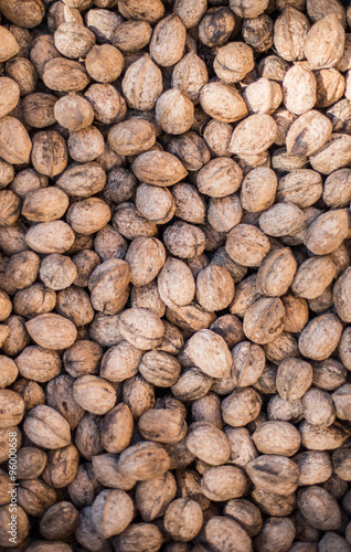 Walnut background  scattered pile of walnuts