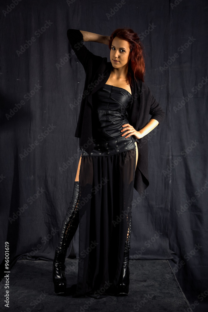 Gothic girl in leather dress and stockings