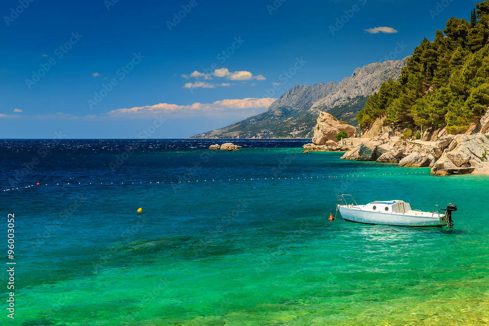 Beautiful bay and beach with motorboat,Brela,Dalmatia region,Croatia Beautiful bay and beach with motorboat,Brela,Dalmatia region,Croatia