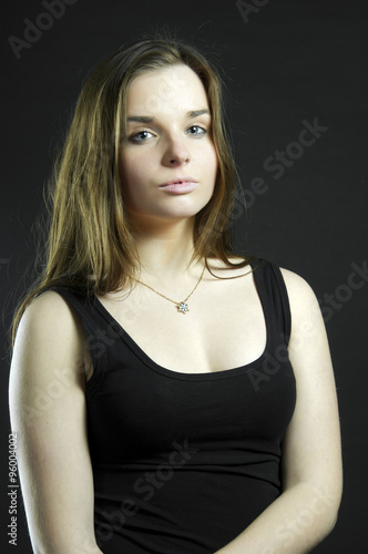 Portrait young beautiful girl in black dress