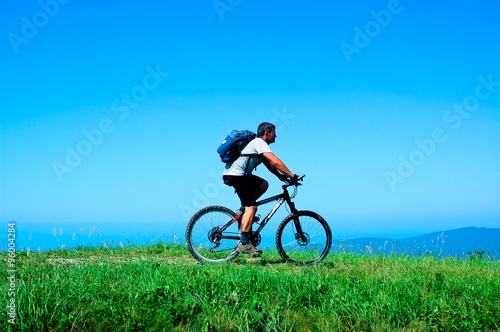 Cyclist rides a bicycle