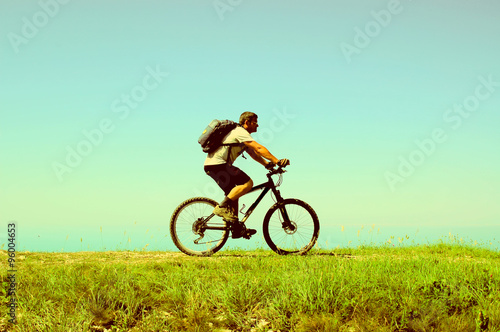 Man rides a bicycle © unclepodger